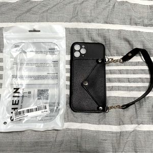 📱 NWT IPhone 11pro phone case wristlet, wallet. Black, silver, and gold.